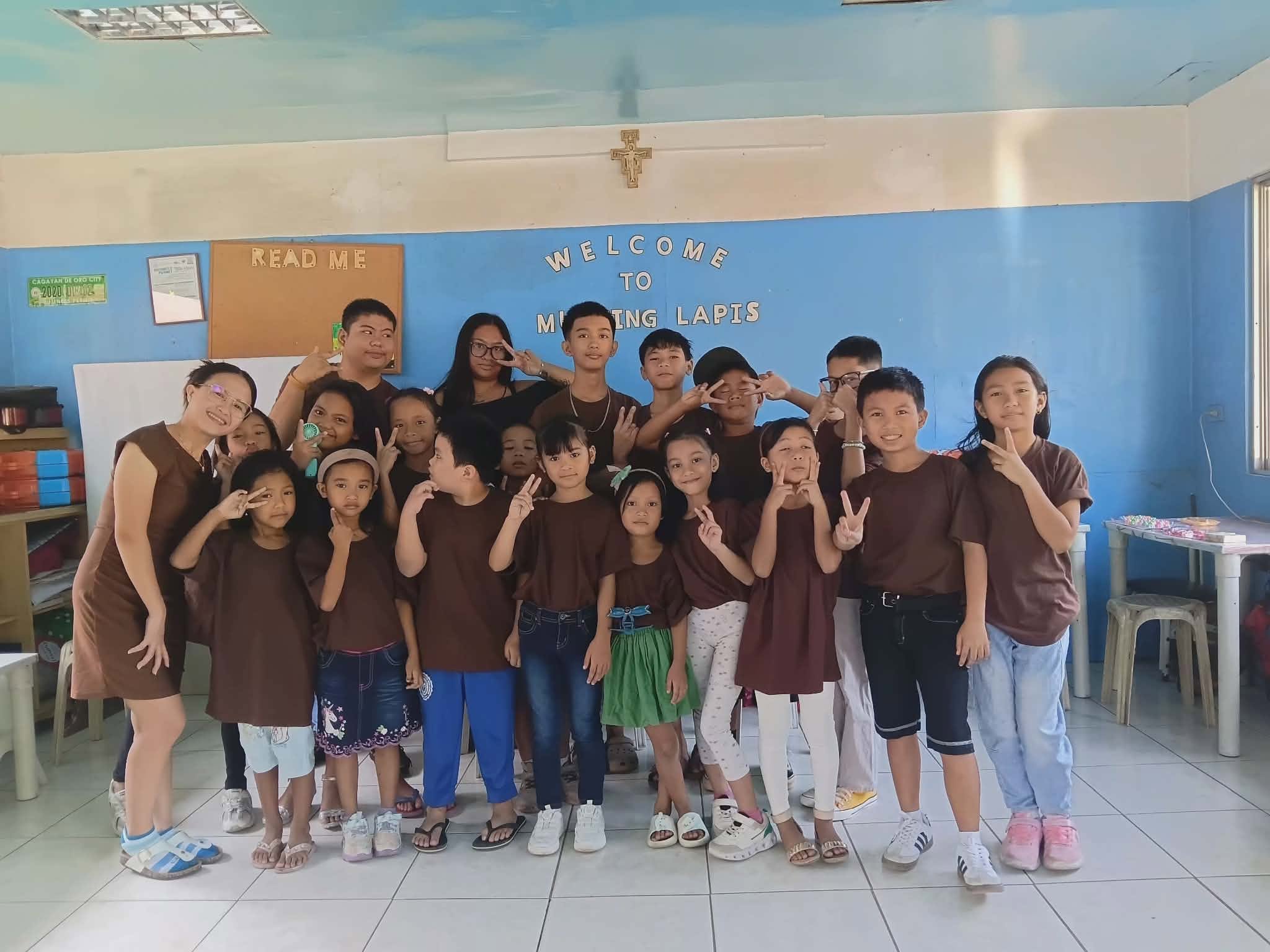 Children and volunteers gather inside the center